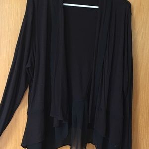 Maurice’s black cardigan.